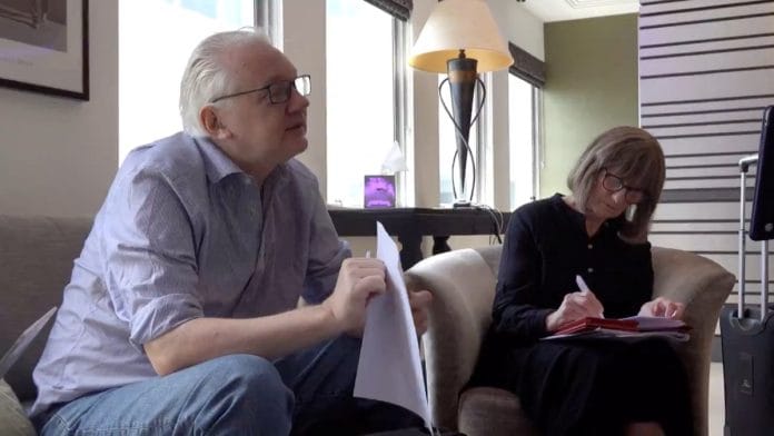 WikiLeaks founder Julian Assange holds a document at a location given as London, Britain, in this still image from video released June 25, 2024 | Reuters