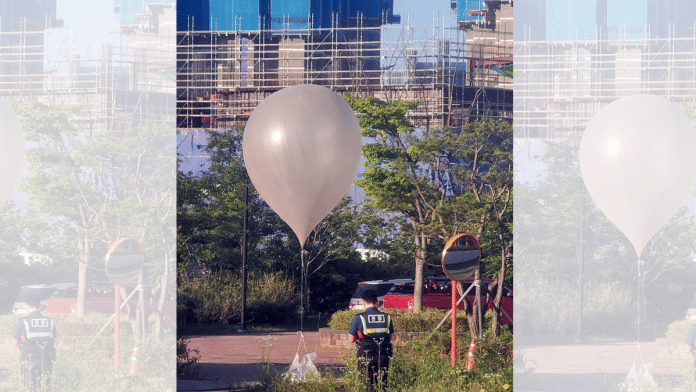 A balloon believed to have been sent by North Korea, carrying various objects including what appeared to be trash, is pictured at a park in Incheon, South Korea, 2 June 2024 | Yonhap via Reuters