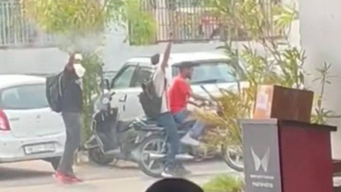 A still from video of Mahindra car dealership firing incident in Haryana's Hisar | X