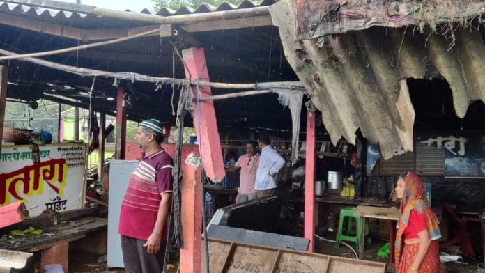Residents of Gajapur stand within a destroyed structure | Photo: By Special arrangement