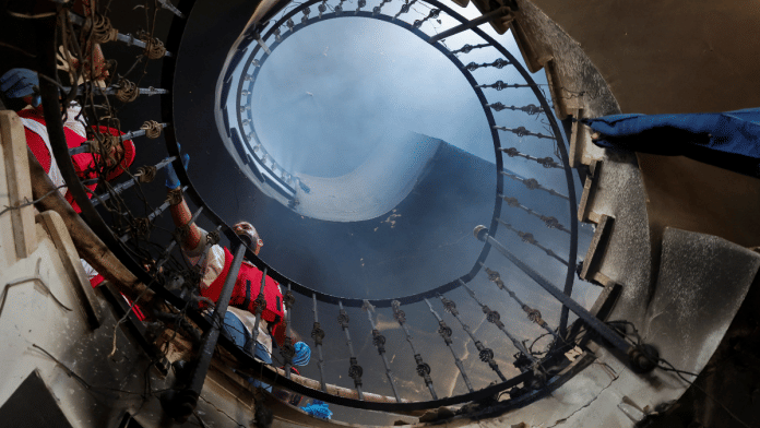 People inspect a damaged building on the day of an Israeli raid in Jenin camp, in the Israeli-occupied West Bank | Reuters/Raneen Sawafta