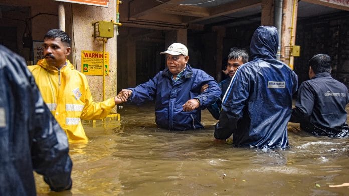 Locals being evacuated due to heavy waterlogging following incessant rains, in Pune district, Thursday, July 25, 2024. The India Meteorological Department (IMD) has issued a red alert, forecasting continued downpours in the district | PTI