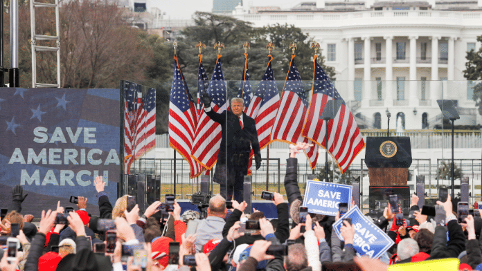 U.S. President Donald Trump waves to supporters during a rally | File Photo | Reuters | Jim Bourg