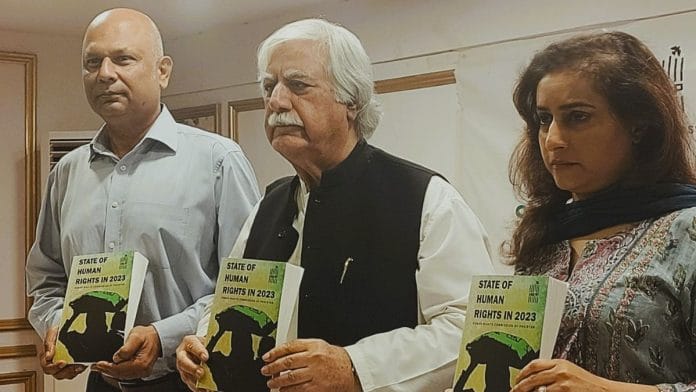 HRCP chairman Asad Iqbal Butt (centre) was picked up from Karachi | X