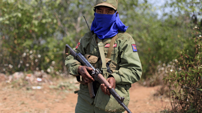 A rebel soldier of the Myanmar National Democratic Alliance Army (MNDAA) holds his rifle as he guards near a military base in Kokang region | File Photo | Reuters
