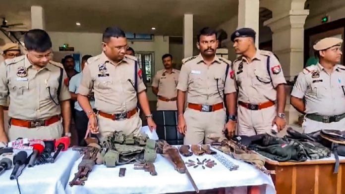 Police personnel display the arms and ammunition recovered after an encounter with alleged Hmar terrorists, in Cachar district of Assam, Wednesday, July 17, 2024. At least 3 militants were killed in the encounter, according to officials | PTI