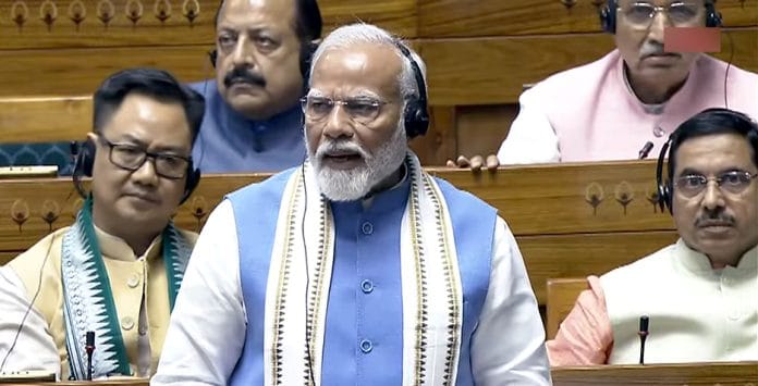 Prime Minister Narendra Modi speaks in the Lok Sabha during the ongoing Parliament session, in New Delhi on Tuesday | ANI Photo/Sansad TV
