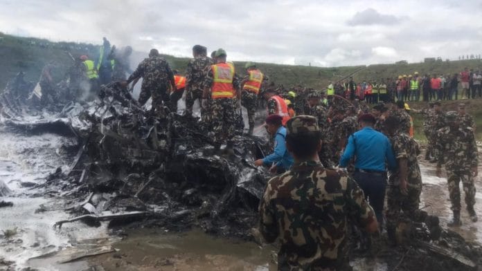 Nepali Army personnel during a rescue operation after an plane crashed at Tribhuvan International Airport, in Kathmandu | PTI