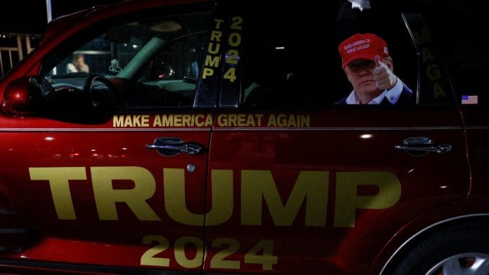 A car with an image of Republican presidential candidate and former U.S. President Donald Trump is parked after he was injured when shots were fired during a campaign rally held in Butler, outside Trump's Mar-a-Lago resort in Palm Beach, Florida, U.S., July 13 , 2024 | Reuters