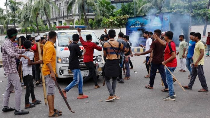 Demonstrators stop an ambulance to check whether there are any patients inside before allowing it to leave during a protest demanding the stepping down of Bangladeshi Prime Minister Sheikh Hasina, following quota reform protests by students, in Dhaka, Bangladesh, August 4, 2024. REUTERS/Mohammad Ponir Hossain