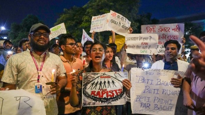 Members of several Resident Doctors Associations protest against rape and murder of a woman doctor at Kolkata's RG Kar Medical College and Hospital, in New Delhi on,18th August | Credit: PTI Photo/Kamal Singh