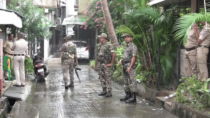 Representational image of security personnel guarding RG Kar Hospital victim's house, in Kolkata as CBI team visits, Monday, 19 August, 2024 | Credit: PTI