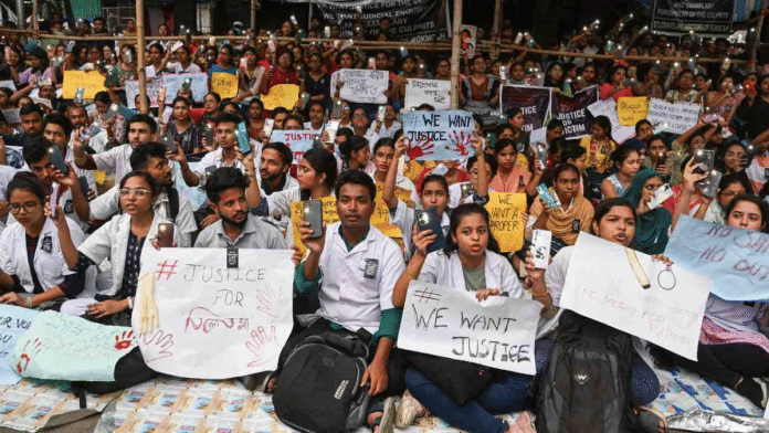 People protest near R. G. Kar Medical College and Hospital protesting against rape and murder of a trainee doctor, in Kolkata, Monday, 12 August, 2024 | Credit: PTI