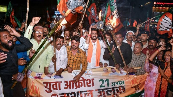 Bharatiya Janata Yuva Morcha (BJYM) members take out a torch rally against the Jharkhand Government, in Ranchi on Wednesday | ANI