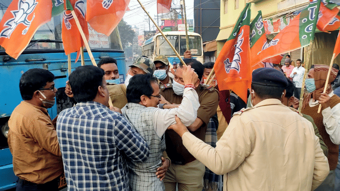Police personnel detain BJP supporters during the BJP's 12-hour Statewide Bandh as part of a protest against Trinamool Congress | ANI