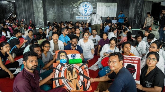 All India Institute of Medical Sciences (AIIMS) doctors hold placards as they stage a protest demanding justice for the alleged sexual assault and murder of a female postgraduate trainee doctor of Kolkata's RG Kar Medical College, in New Delhi on Saturday | ANI