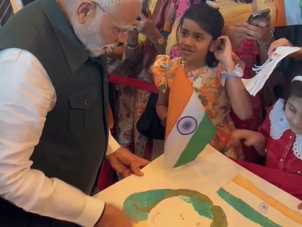 PM Modi interacts with a little girl upon his visit in Brunei