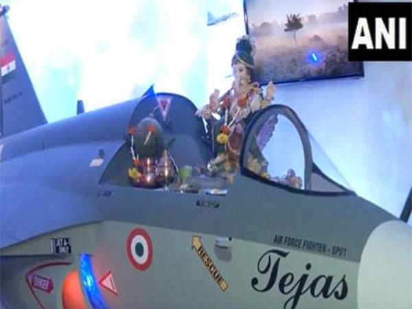 Ganpati idol seated on LCA Tejas Mark 1A fighter jet replica at Mumbai residence