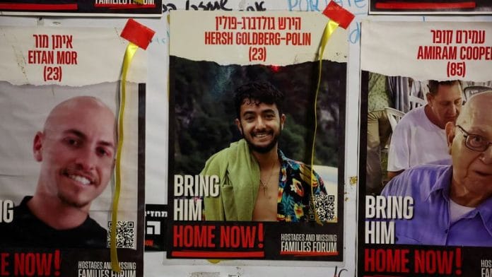 A view of a banner depicting Hersh Goldberg-Polin, an Israeli-American seized during the October 7 attack on Israel and taken hostage into Gaza, Tel Aviv, Israel, April 24, 2024. REUTERS/Hannah McKay/File Photo
