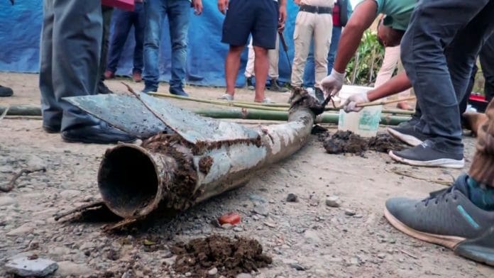 A team of Mobile Forensic Unit, DFS, Manipur collects evidence after what appeared to be a rocket attack, in the Moirang area of Bishnupur on Friday, 6 September, 2024 | ANI