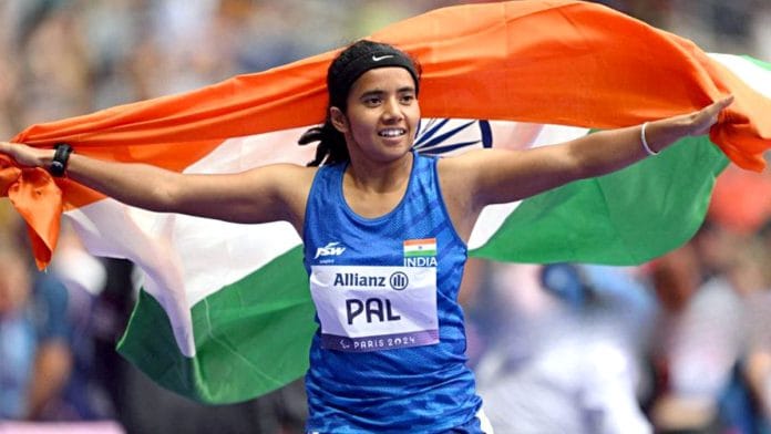 India's Preethi Pal holding the national flag celebrates her Bronze medal victory in the Women's 100m – T35 race, at the Paris Paralympics 2024 | Representational image | ANI