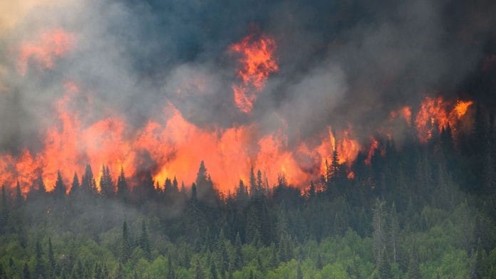 Wildfire as seen from a Canadian Forces helicopter surveying the area near Mistissini, Quebec, Canada, 12 June, 2023 | Photo: Cpl Marc-Andre Leclerc/Canadian Forces/Handout via REUTERS