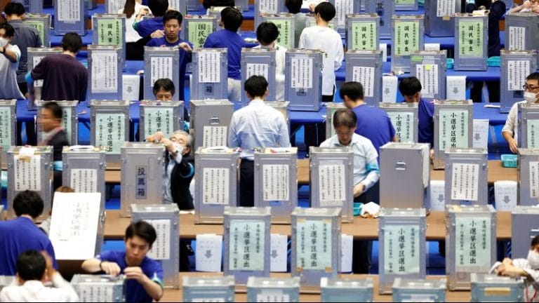 Japan’s ruling coalition may lose majority as exit polls show strong gains for opposition parties