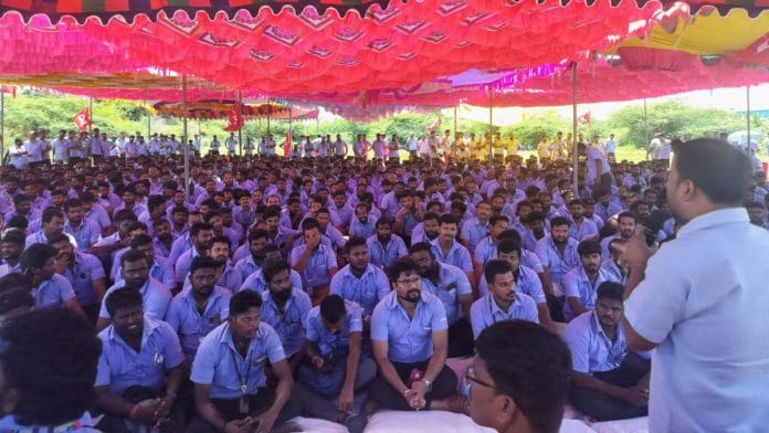 A file photo of workers of a Samsung facility listening to a speaker during a strike to demand higher wages at its Sriperumbudur plant near Chennai. | Reuters