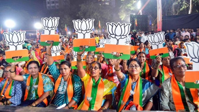 Supporters of the BJP brandish the party logo at a public meeting in Mumbai earlier this month | Photo: ANI
