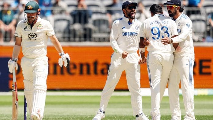 India's Virat Kohli, K.L. Rahul and captain Jasprit Bumrah celebrate the dismissal of Australia's Travis Head | Photo: ANI