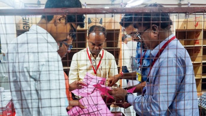 Polling staff counts postal ballot votes for the Maharashtra assembly elections Saturday | Photo: ANI