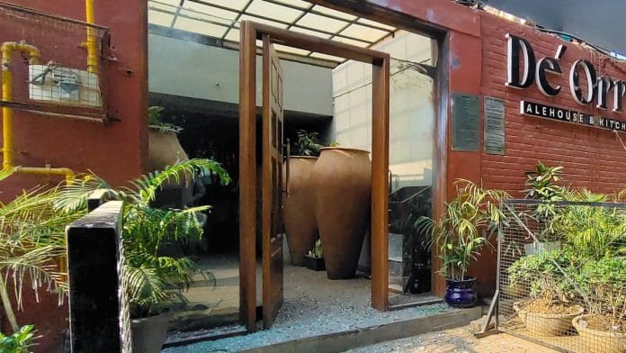 Pieces of broken window glass lie on the floor after an explosion outside a club in Chandigarh, Tuesday, Nov. 26, 2024 | PTI