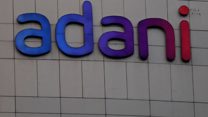 The logo of the Adani Group is seen on the facade of its Corporate House on the outskirts of Ahmedabad, India, 27 January 2023 | Amit Dave | Reuters