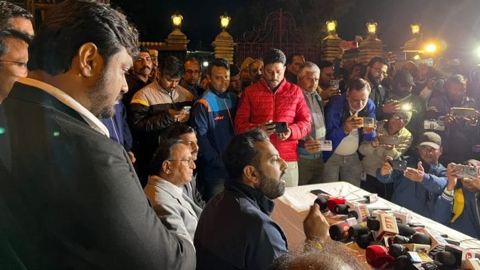 Lakshyaraj Singh (center) speaking to the media Tuesday night | Antara Baruah | ThePrint