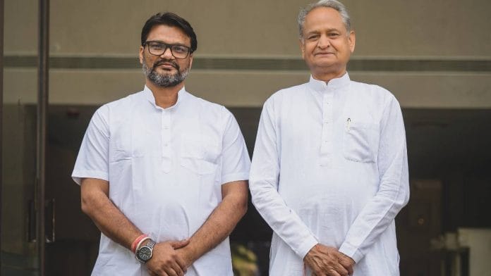 Lokesh Sharma (left) with Ashok Gehlot | Photo: X/@_lokeshsharma