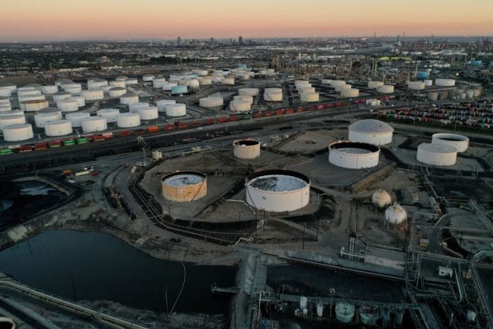 Oil prices hold near 2-week low after OPEC cuts demand view, dollar ...