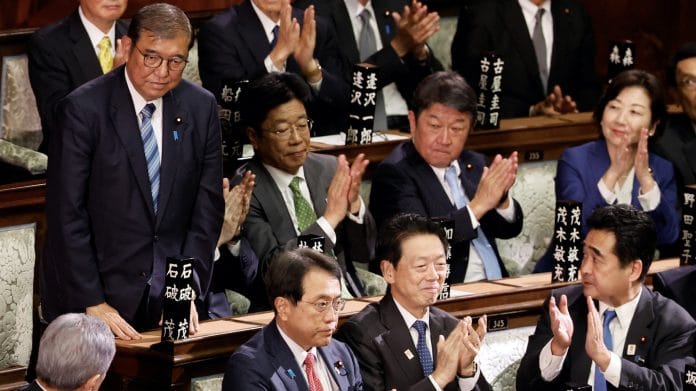 Japanese Prime Minister Shigeru Ishiba reacts as he receives applause after being reelected as prime minister, at the Lower House of Parliament in Tokyo, Japan, 11 November 2024 | Kim Kyung-Hoon | Reuters