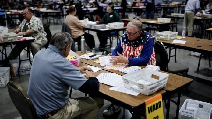 Electoral workers count votes during the 2024 U.S. presidential election, in Milwaukee, Wisconsin | Eduardo Munoz | Reuters