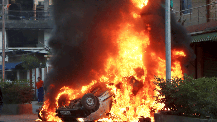 File photo of a car set on fire during protests in Imphal on Saturday | PTI