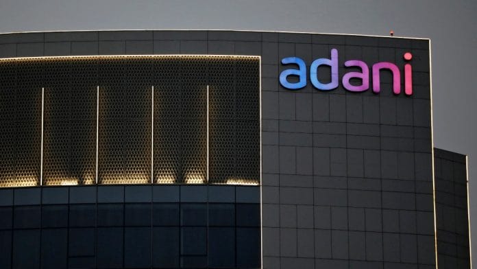 The logo of the Adani Group is seen on the facade of one of its buildings on the outskirts of Ahmedabad, India, April 13, 2021 | Reuters