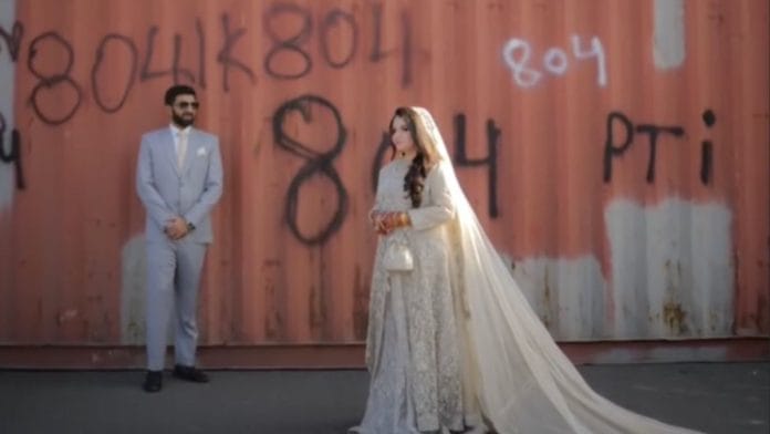 The couple pose in front of the containers spray painted with 804, a reference to Imran Khan. | thetalentstudios / Instagram