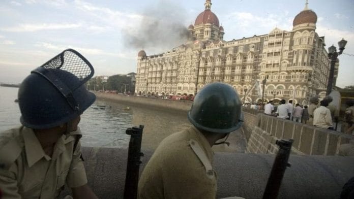 Police personnel outside the Taj Mahal Hotel during the siege by terrorists in Mumbai, on 25 November 2008 | Prashanth Vishwanathan | Bloomberg