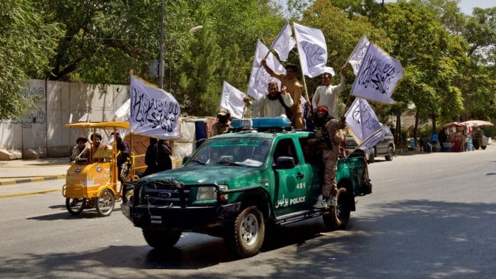 Members of the Taliban carrying flags participate in a rally to mark the third anniversary of the fall of Kabul, in Kabul, Afghanistan, August 14, 2024 | Reuters file photo