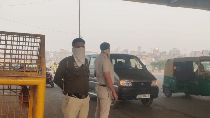 Police officers wearing handkerchiefs on patrol duty in Wazirpur | Mrinalini Dhyani | ThePrint