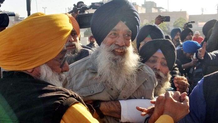 Shooter Narain Singh Chaura being taken into custody after he tried to fire a bullet on Sukhbir Singh Badal, at Golden Temple in Amritsar, Wednesday. | ANI