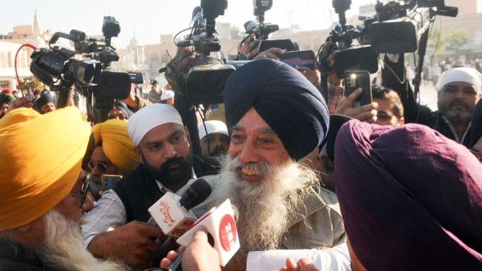 Shooter Narain Singh Chaura being taken into custody, 4 December. Chaura has links to the Khalistan movement in Punjab, raising national security concerns