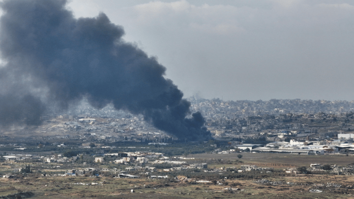 A drone view shows smoke above Beit Hanoun in the Gaza Strip, amid the ongoing conflict in Gaza between Israel and Hamas, as seen from near Kibbutz Nir Am in southern Israel, on 12 December 2024. | Ilan Rosenberg | Reuters