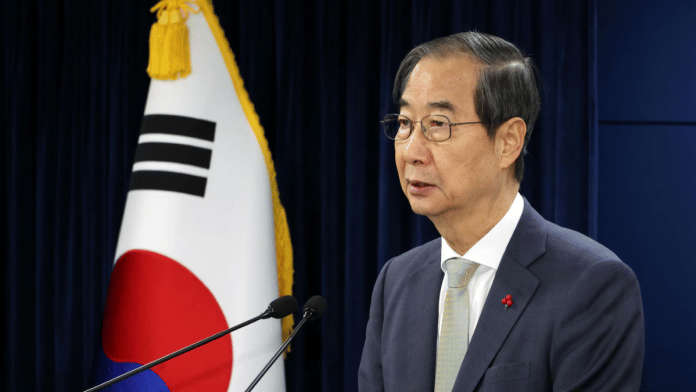 Acting South Korean President and Prime Minister Han Duck-soo delivers an address to the nation at the government complex in Seoul, South Korea, on 14 December 2024. | Yonhap via Reuters