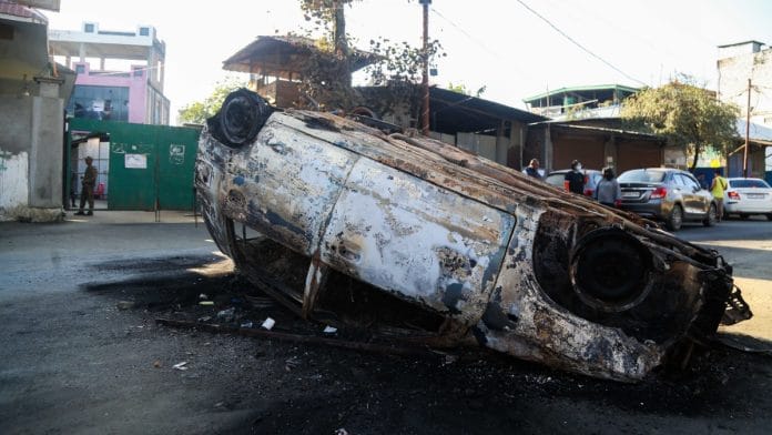 File photo of a vehicle overturned during a violent protest in Imphal, Manipur | Suraj Singh Bisht | ThePrint