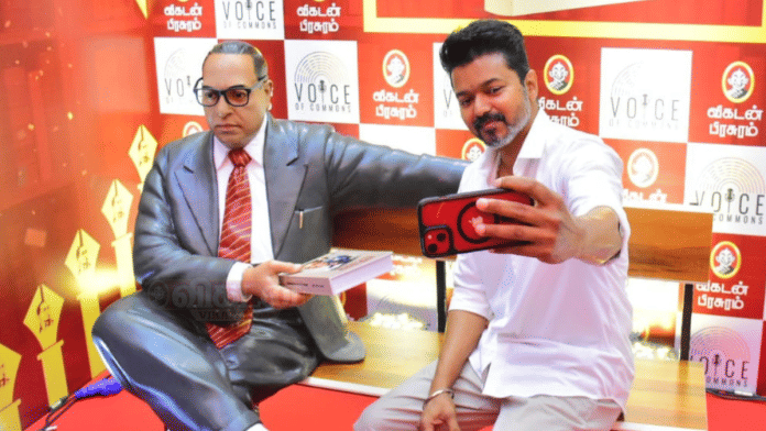 Actor-politician Vijay poses for a selfie with Ambedkar statue at a book launch event in Chennai | X/@ActorVijayUniv
